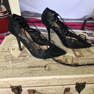 Sexy strappy heels with lace-like cut-outs.